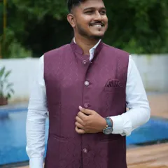 This client is wearing our deep wine-colored waistcoat. The rich color and texture make it a great choice for an evening function or a festive family gathering.