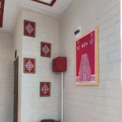 A complete view of the entrance makeover featuring Kolam art. We combined a large Tirupati inspired panel with smaller framed Kolam designs for a cohesive, traditional look.