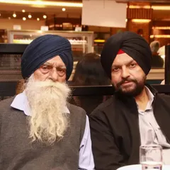 A portrait of two gentlemen at a family dinner. I make sure to capture photos of all your important guests.