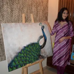 Here I am with the finished large-scale peacock painting. This piece was the result of many hours of patient work, layers of paint, and lots of good music.