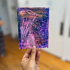 An abstract piece made by a young student using the sgraffito technique, where layers of oil pastels are scratched to reveal colors underneath.