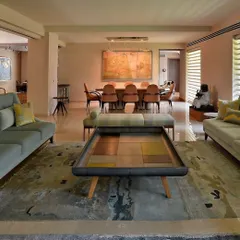 In this Delhi renovation, I removed interior walls to create a flowing, open-plan living and dining area. A consciously chosen pastel palette of soft blues, lavenders, and beiges enhances the lightness and creates an oasis of calm in the city.