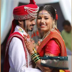 A candid shot of a happy bride and groom. Her traditional Maharashtrian look, complete with a mundavalya and nath, was a joy to create.