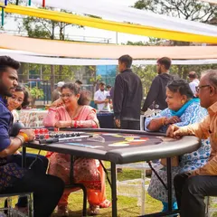 A casino-themed party is a great way to entertain guests. Here, family members are enjoying a game of poker at one of the tables I set up for the event.
