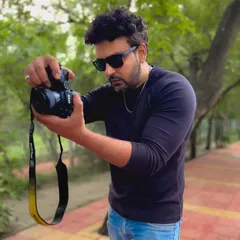 Caught in the act of checking my shot. I’m deeply involved in every detail on set to make sure the final image is perfect.