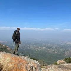 A moment of quiet reflection overlooking the expansive landscape from Savandurga hill. The views from the top are always worth the climb.