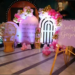 A dreamy "Twinkle Twinkle Little Star" baby shower. We used a soft lavender and pink color palette with backlit backdrops, a wicker peacock chair, and a custom sign to create a magical and ethereal atmosphere for the mom-to-be.