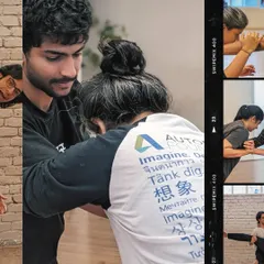 An instructor provides hands-on guidance during a partner stretching exercise, ensuring proper technique and safety.