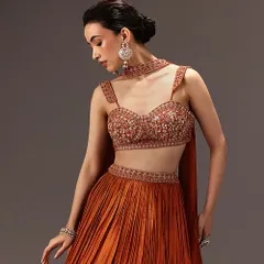 A sophisticated look featuring a clean, low bun and soft glam makeup. This style is perfect for a cocktail party or reception, complementing the embellished blouse beautifully.