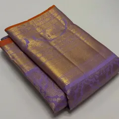 A closer look at the intricate weaving on the border and pallu of the lavender Kanchi Pattu saree.