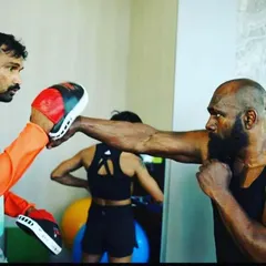 Focused and precise. This is me working on my own striking technique during a pad work session. As a coach, I believe in constantly sharpening my own skills to provide the best possible training for my students.