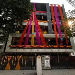 Another angle of the daytime home exterior decoration, showing how the drapes are arranged to cover multiple floors and create a grand visual impact.