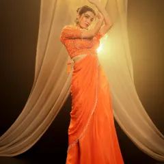 I use controlled studio lighting to make colors pop, as seen in this vibrant ethnic wear shoot. The setup with warm light and flowing fabric creates a dramatic and elegant mood, ideal for designer lookbooks and festive campaigns.