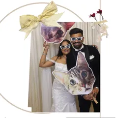 Even the pets can join the party. We love creating custom props, like these cat faces for a couple's wedding reception, to add a personal and humorous touch that reflects your unique story.