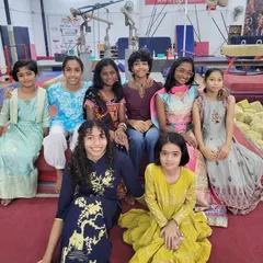 It's always a pleasure to see our gymnasts outside their leotards. This photo from a festive celebration showcases their vibrant personalities and the strong friendships within our team.