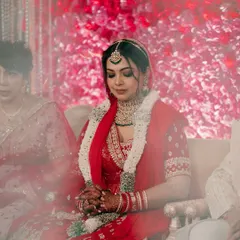 "Behind the veil, beyond the pose." This is a moment of pure, unfiltered emotion, capturing the bride's serene beauty and quiet contemplation on her wedding day.