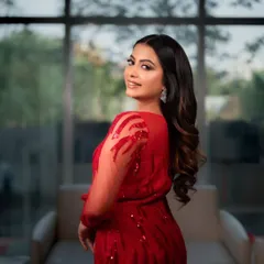 A glamorous portrait of a model in a stunning red gown, showcasing my work in fashion and portfolio photography.