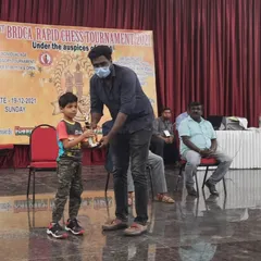 Aadhiran Thangarathan, one of our promising young players, proudly holding his first-place trophy from the 41st BRDCA Rapid Chess Tournament in the U-07 category.
