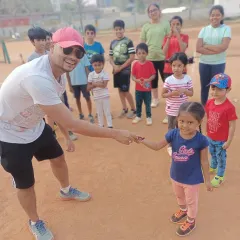 That smile is what it's all about! Celebrating our youngest 'Player of the Week' winners. I make sure to recognize effort and a great attitude at every age, which is a core part of our kids' tennis program.