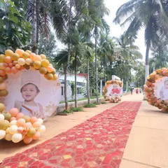 A grand red carpet entrance for a child's birthday party. We lined the walkway with large circular photo displays of the birthday girl, framed with custom balloon arrangements.