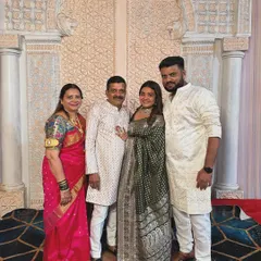 A full family portrait. Wearing my mother's wedding saree next to my family was a very emotional and proud moment for me.