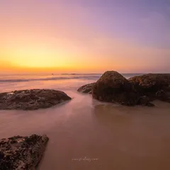 A serene sunset at Padubidri beach. As the day comes to an end, the ocean's calm and the sky's soft colors create a moment of pure delight.