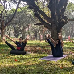 Students exploring variations of poses like Upavistha Konasana. My classes encourage you to listen to your body and find the expression of the pose that works for you on any given day.