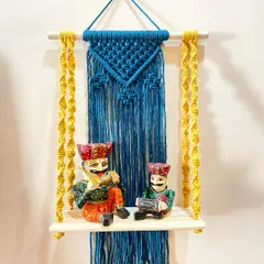 A vibrant wall shelf in royal blue and bright yellow. This piece is perfect for displaying small idols or collectibles, adding both color and functional storage to your wall.