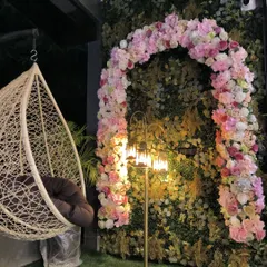 I converted a basic salon entrance into an extreme photo-worthy spot with this floral arch against a green wall backdrop. It's a great way to attract customers.