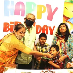 A sweet moment between generations. Grandparents sharing in the joy of a birthday celebration is what it's all about. We provide a comfortable and happy environment for the entire family.