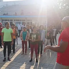 Our swimmers participate in a dry land fitness session with coach Atiba Wade. These sessions are crucial for building core strength, flexibility, and overall athleticism.