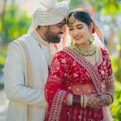 An intimate portrait of a Sindhi couple, their faces close together, capturing the love and happiness of their wedding day.