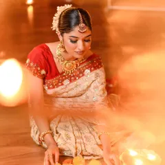 A dreamy, candlelit shot from our Diwali series. The makeup looks soft and luminous in the warm light.