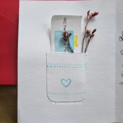 The inside of the puzzle-themed card features a small, hand-painted pocket, perfect for tucking in a personal note or a gift card.
