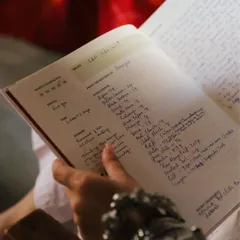 A close-up of a treasured recipe for 'Raan,' handwritten with care. Our journals are designed to capture every detail, from precise measurements to the memories associated with a dish, like a special Sunday meal. These are the details that keep a family's food story alive.