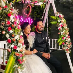 A romantic floral swing we curated for a beautiful couple. The swing is adorned with fresh flowers and a custom "You & Me" neon sign, creating the perfect picturesque photo booth for any pre-wedding event or reception.