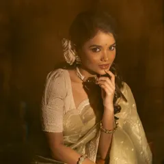 A collection of images from a retro-themed photoshoot with the beautiful actress Sanjana Tiwari. I created a soft, classic hairstyle with side-swept curls and floral accents to match the vintage aesthetic.