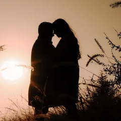 A perfect silhouette against a golden sunset in the hills of Shimla. Destination pre-wedding shoots like this are all about finding those magical moments where it feels like you're the only two people in the world.