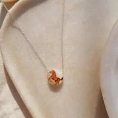 Another view of the "Oliver's Horse" pendant. The white moonstone base provides a beautiful canvas and adds the energy of abundance.