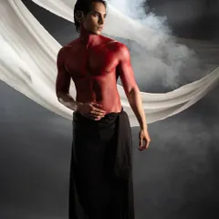 Body painting is a powerful way to tell a story. For this conceptual shoot, I used bold red body paint to create a striking, mythological character, sculpting with color and shadow.