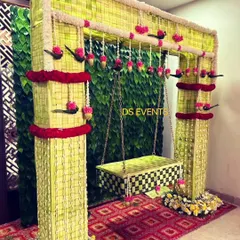 For a beautiful and eco-friendly naming ceremony, I designed this swing and backdrop entirely from woven coconut leaves. It’s a testament to how traditional materials can create stunning, sustainable decor.
