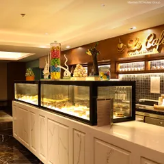 Our pastry and confectionery display at Le Cafe. We offer a tempting array of cakes, sweets, and savories to accompany your coffee or tea.