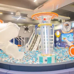 A glimpse of our main play area, featuring the huge ball pit, slides, and a central tower. It's a safe, clean, and vibrant space designed for hours of climbing, sliding, and adventure.