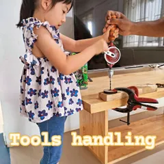 With a little help, a student learns the proper technique for using a hand drill. Our instructors ensure every child is supported as they learn new skills.
