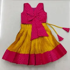 This is a cute and modern langa blouse design. I used a bright pink and yellow combination and added a large bow for a playful touch.