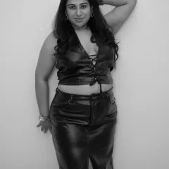 A classic black and white shot in a leather outfit. This photo captures the combination of charm, beauty, and music that defines my style.