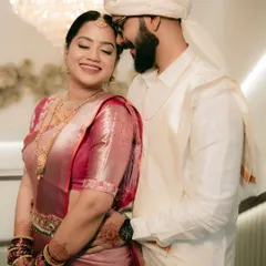 An intimate portrait of a South Indian couple, capturing the warmth and happiness in their embrace.
