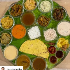 A top-down view of my Sadya, as shared by a happy client. This spread features over 20 distinct items, including multiple curries, thorans, pachadi, pickles, chips, and two types of rice, offering a complete journey through Kerala's vegetarian cuisine.