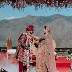 Amidst the serene majesty of the Mussoorie hills, two souls become one. The exchange of garlands is a pivotal moment, and I frame it against the epic landscape to signify that their love is as vast and enduring as the mountains themselves. This is where nature bears witness to forever.