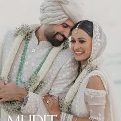 A joyful and candid portrait of a couple after their beach wedding ceremony in Thailand, full of smiles and love.